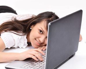 closeup. smiling young woman with laptop in the workplace.