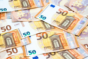 Pile of many fifty euro banknotes use for money or currency background and financial concepts.
