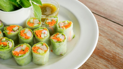 Fresh spring rolls with assorted vegetables with spicy sauce.