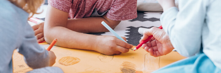 Children drawing during art classes