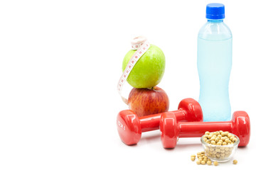Dumbbells, apple, electrolyte drink and soybeans isolated on white, fitness and exercise concept
