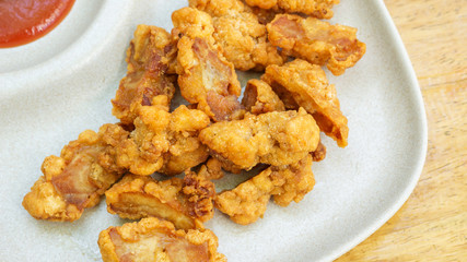 fried chicken on a wooden table.