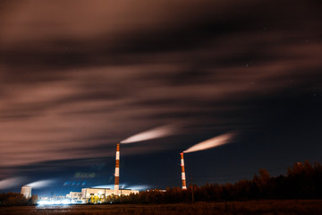 Energy. Smoke from chimney of power plant or station. Industrial landscape.