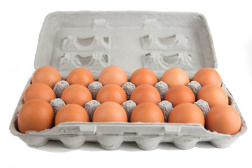 eggs in egg box on white background