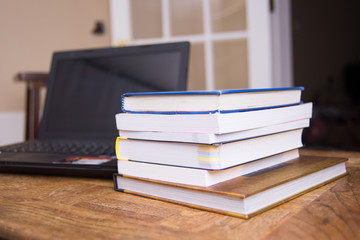 Working desk.Open laptop, books office