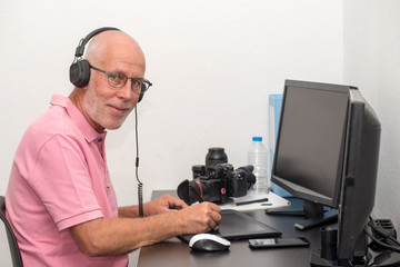 Fototapeta na wymiar mature man working on his graphics tablet