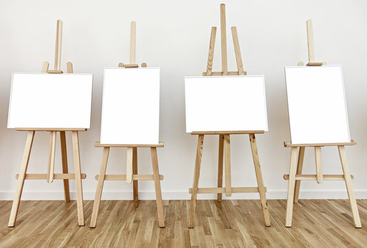 Four Art Studio Easels With Blank White Frames To Add Paintings Or Pictures 