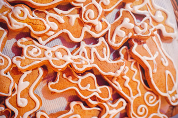 homemade cookies with icing, lies in a wicker basket, warm cozy home color