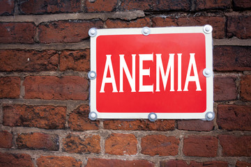 Fototapeta premium Hand writing text caption inspiration showing Anemia concept meaning Medical Diagnosis Iron deficiency aplastic written on old announcement road sign with background and copy space