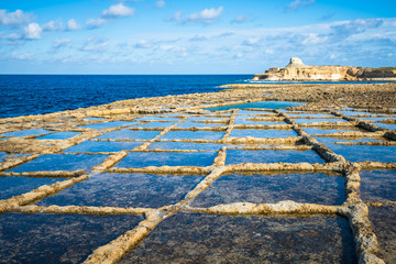 Salt evaporation ponds on Gozo island, Malta - obrazy, fototapety, plakaty