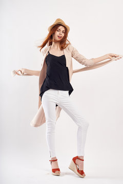 girl in hat posing in light pose