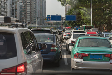 traffic jam on main street with row of cars