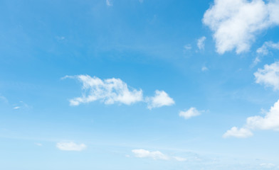 Naklejka na ściany i meble Beautiful summer blue sky and white fluffy clouds.