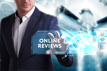 Business, Technology, Internet and network concept. Young businessman working on a virtual screen of the future and sees the inscription: Online reviews