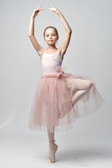 ballerina in the rack, child, gray background