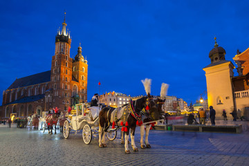 Fototapeta Horse carriages at the Main Square in Krakow, Poland obraz