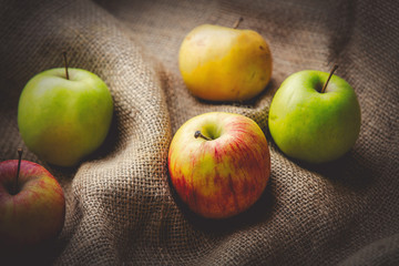 Apples on jute sack background