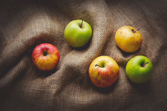 Apples on jute sack background