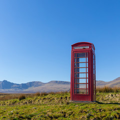 Fototapeta premium Red telephone box at a remote location on the Isle of Skye