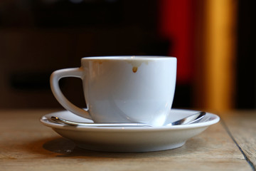 Close up white cup of black coffee on table