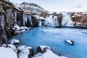 Fototapeta na wymiar Kirkjufell waterfall with mountain in winter, Iceland