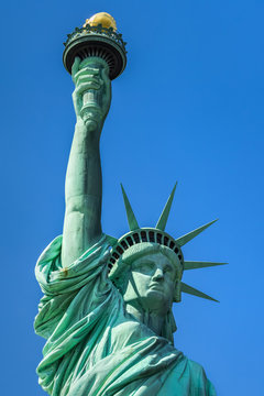 Close-up of the Statue of Liberty with its crown and torch. Liberty Island, New York City