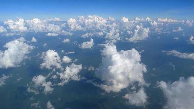 View from the window of the aircraft to the clouds