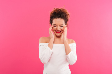 Portrait of a cheerful girl celebrating success