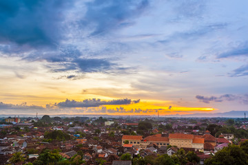 Fototapeta premium City landscape, top view, against the sunset. Yogyakarta, Jawa, Indonesia.