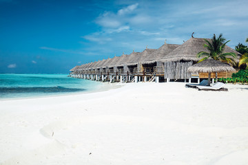 Summer wooden water villas on Maldives