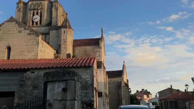 Establishing shot of a picturesque village in the heart of the French countryside