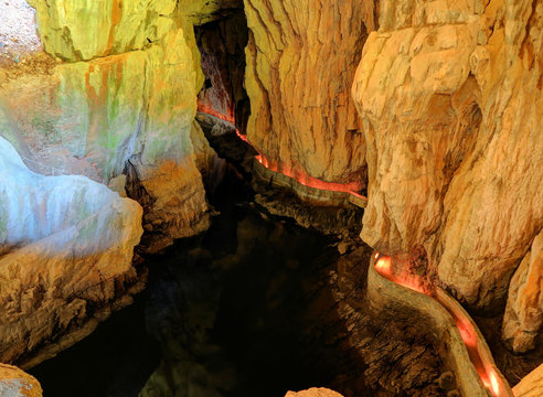 Labyrinthine, illuminated walkways and reflective pool inside Skocjan Caves, one of UNESCO&rsquo;s natural and cultural world heritage sites
