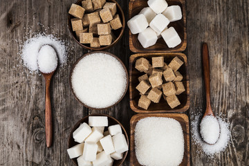 Bowls with sugar and  wooden spoons