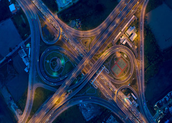 Aerial view Road roundabout, Expressway with car lots in the city in Thailand.beautiful Street , downtown,cityscape,Top view. Background,Aerial view city scape