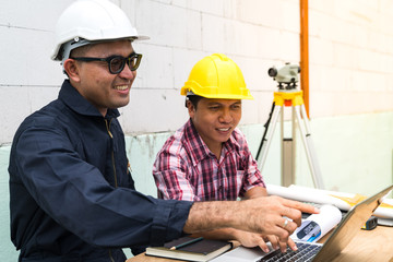 Engineer are work with computer laptop in construction site