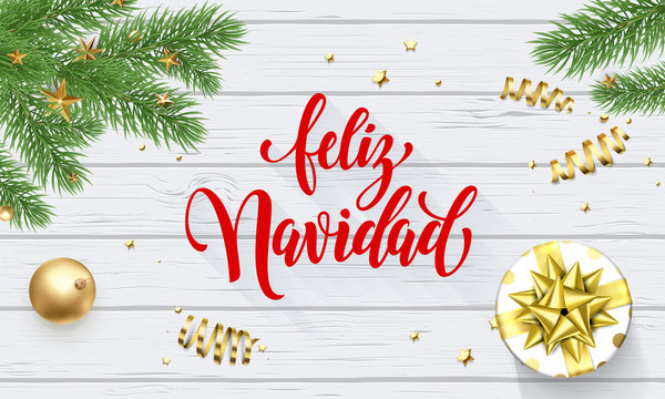 Feliz Navidad Spanish Merry Christmas golden decoration, greeting card calligraphy font on white wooden background. Vector Christmas tree or New Year gift winter holiday gold shiny confetti decoration