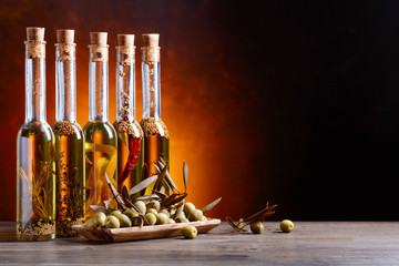 Obraz na płótnie Canvas Green olives and bottles of olive oil .