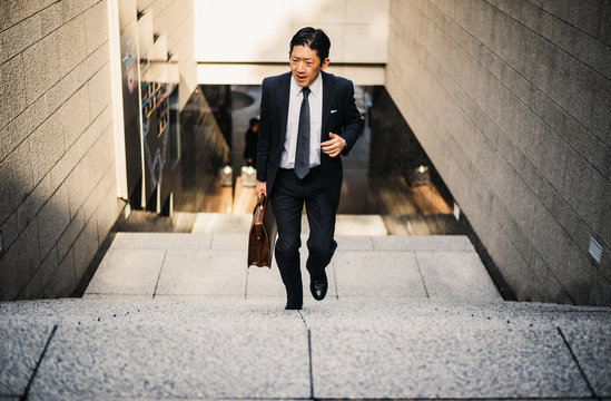 Senior business man moments on the streets of Tokyo