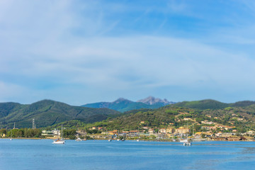 Fototapeta na wymiar Few boats and ships in Elba bay near Italy Tuscany