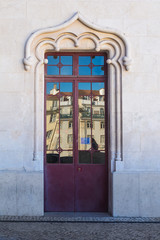 Fototapeta na wymiar Old door with a reflection, Lisbon, Portugal