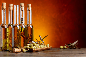Obraz na płótnie Canvas Green olives and bottles of olive oil .