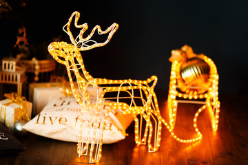 New Year glowing reindeer with sleigh © Parfenova