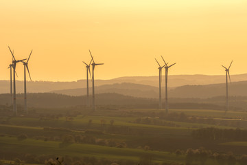 Obraz premium Landscape with Wind turbine in sundown