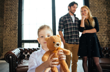 Family home portrait. Parents and son spending time together