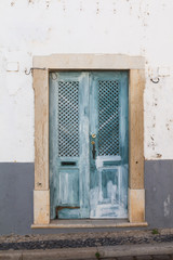 Blue wooden gate in Faro, Portugal