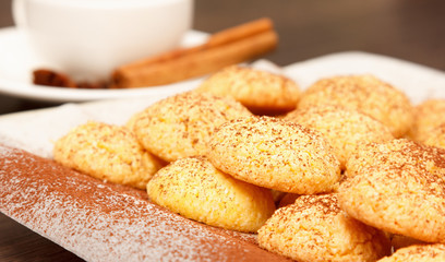 Cookies sprinkled with cocoa with coffee
