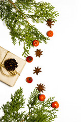 Christmas composition. Christmas gifts, spruce branches on a white wooden background. top view, space for copying text.