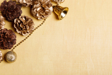 Christmas background with golden pinecones