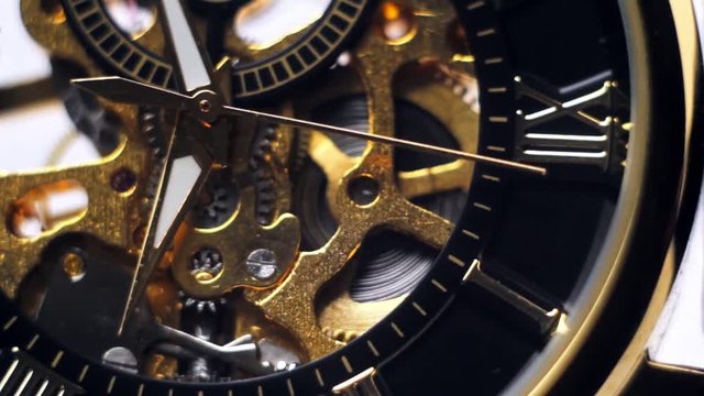 The arrows on the gold watch