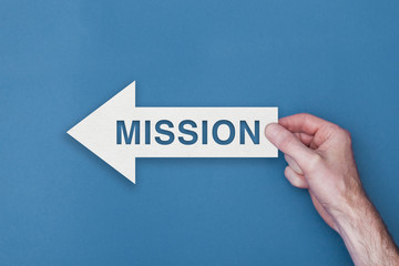 Mission arrow direction held on a blue background